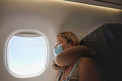 Buy stock photo Shot of a young woman sleeping in the aeroplane