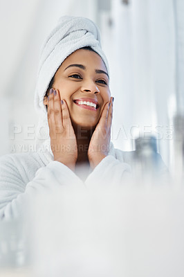 Buy stock photo Shot of a young woman going through her beauty routine at home