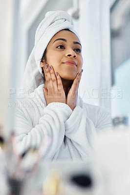 Buy stock photo Shot of a young woman going through her beauty routine at home