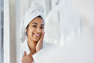 Buy stock photo Shot of a young woman going through her beauty routine at home