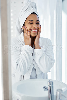 Buy stock photo Shot of a young woman going through her beauty routine at home