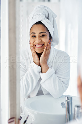 Buy stock photo Shot of a young woman going through her beauty routine at home