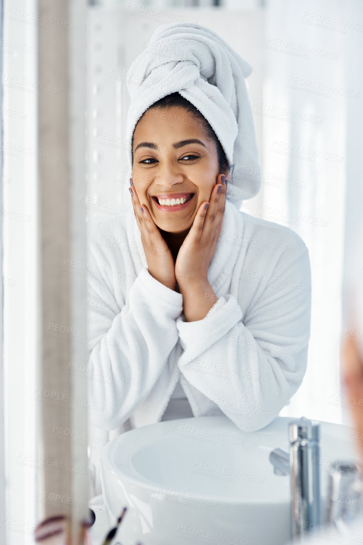 Buy stock photo Shot of a young woman going through her beauty routine at home