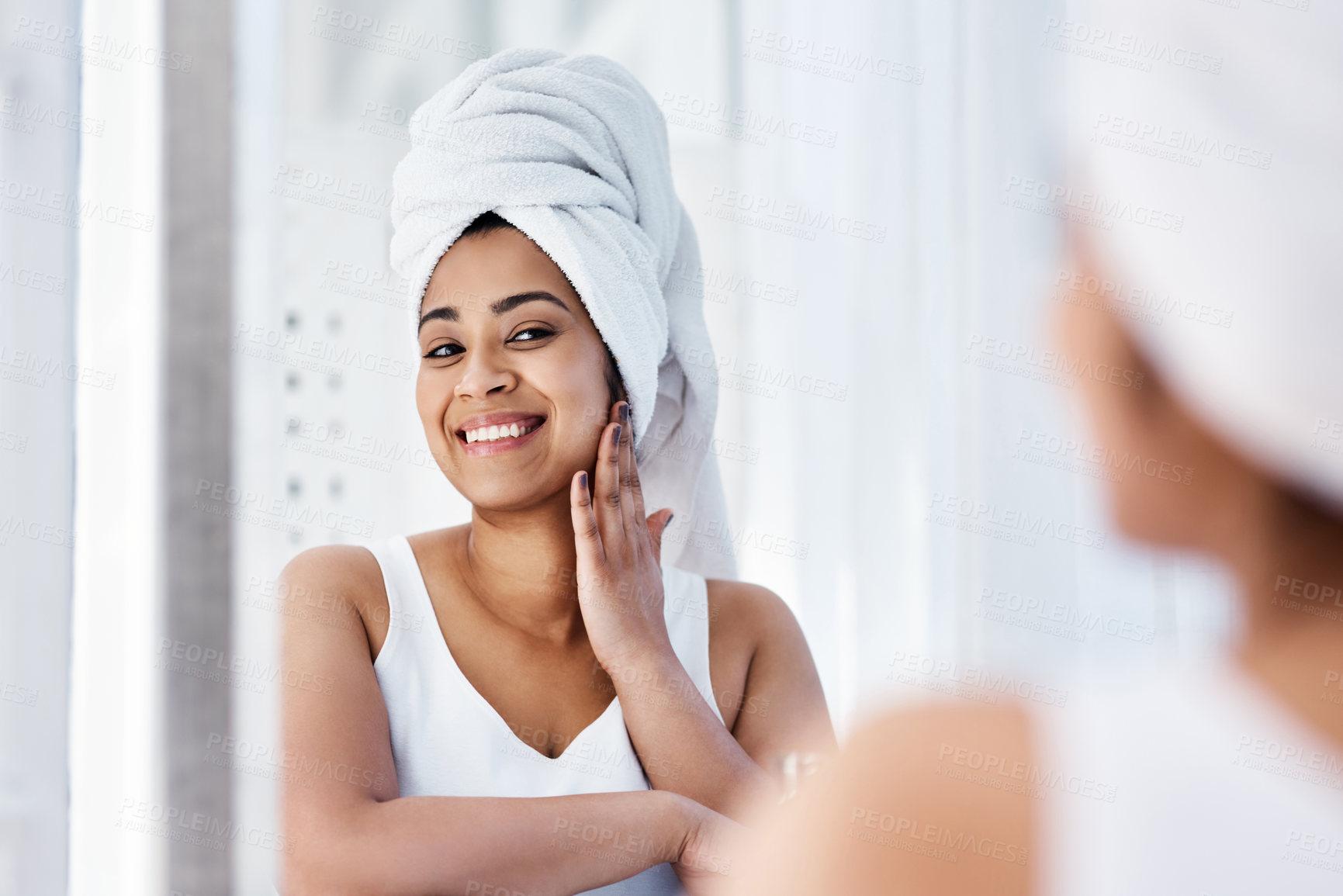 Buy stock photo Shot of a young woman going through her beauty routine at home