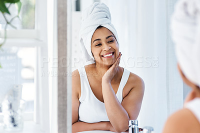 Buy stock photo Shot of a young woman going through her beauty routine at home