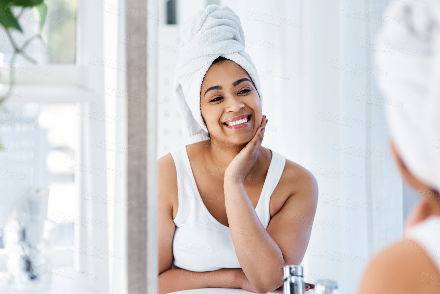 Buy stock photo Shot of a young woman going through her beauty routine at home