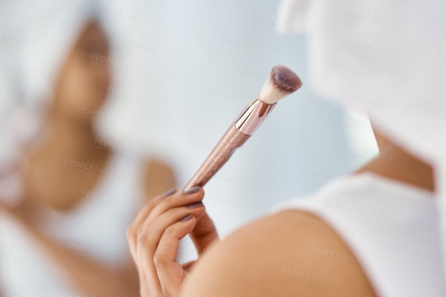 Buy stock photo Shot of a young woman going through her beauty routine at home