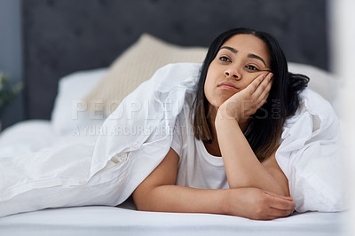 Buy stock photo Shot of a young woman in bed at home