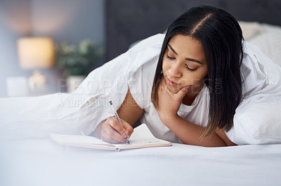 Buy stock photo Shot of a young woman in bed at home