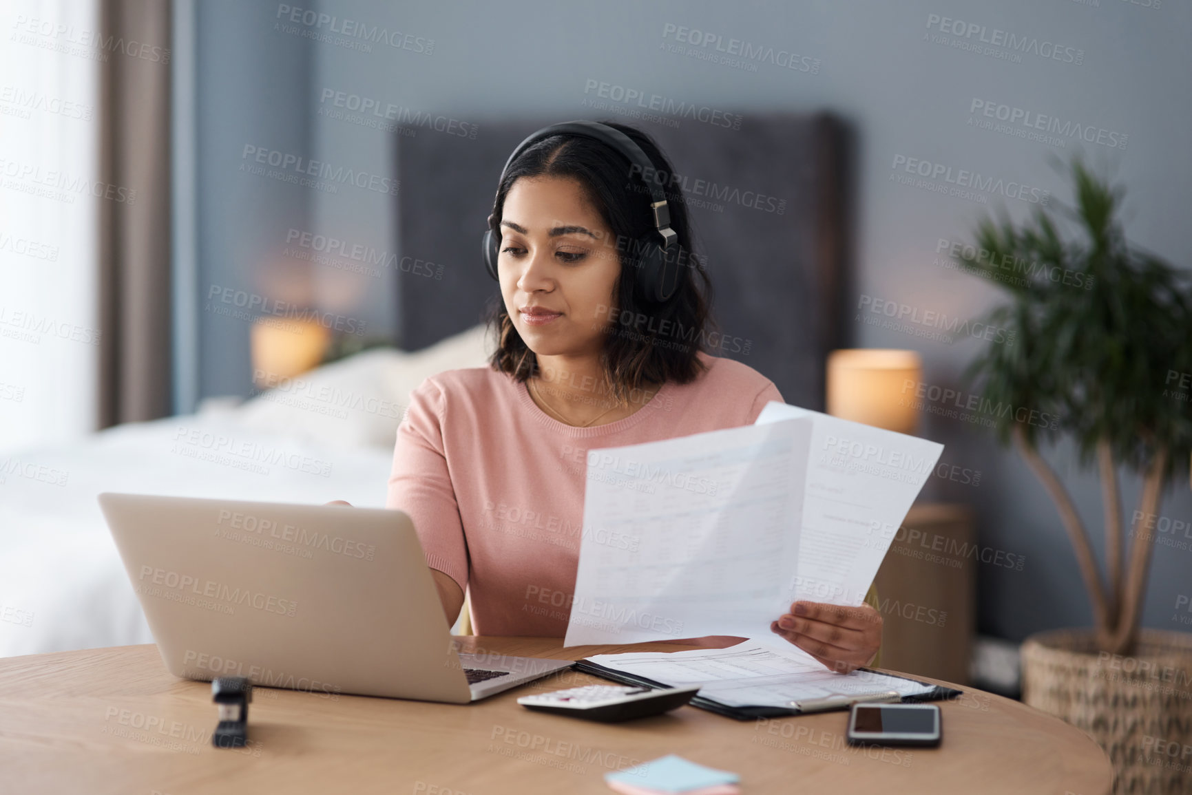 Buy stock photo Shot of a young woman working from home
