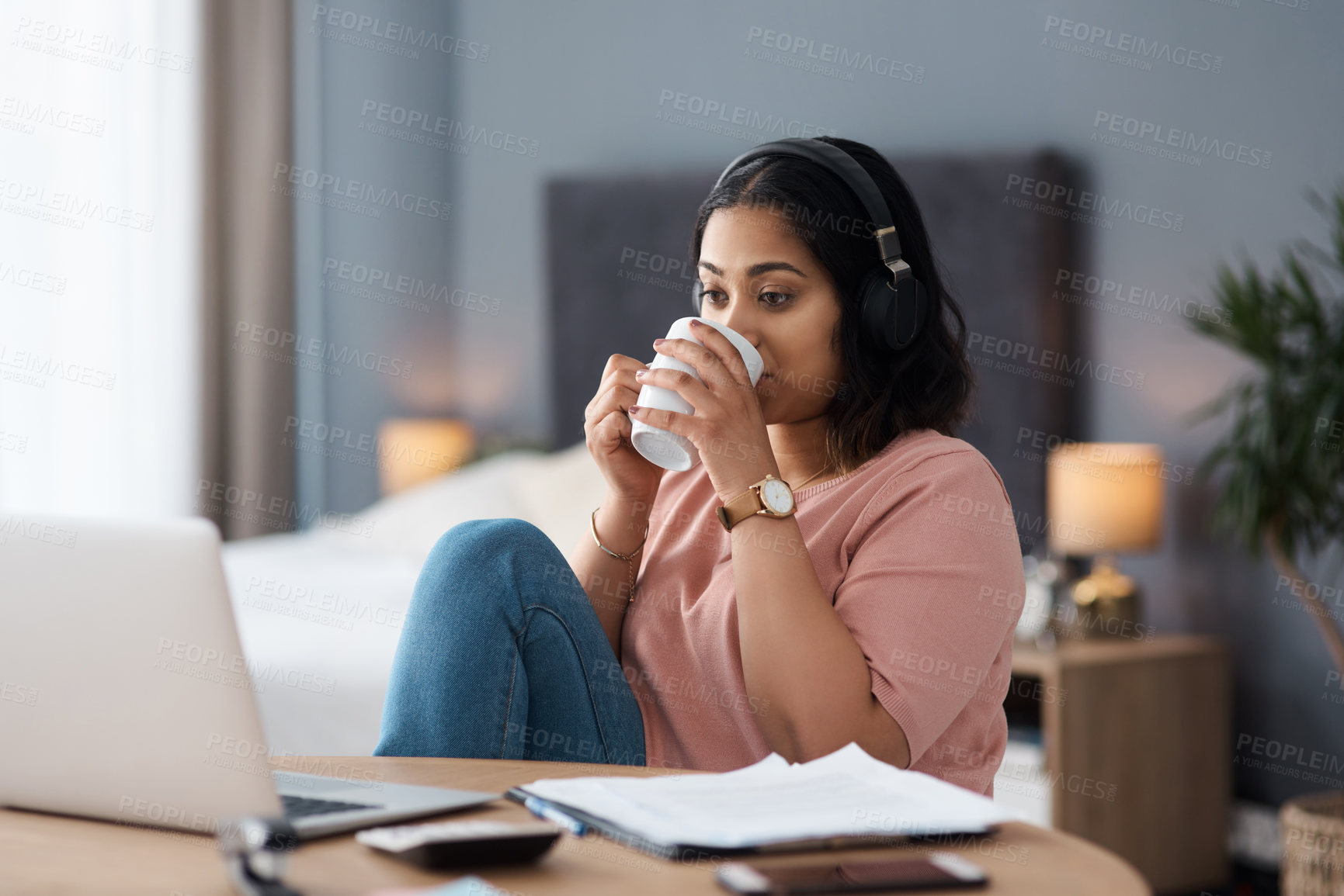 Buy stock photo Shot of a young woman working from home