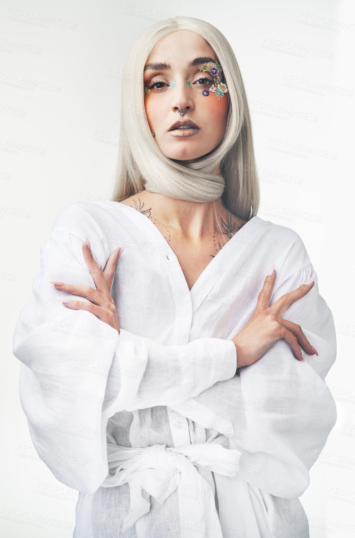 Buy stock photo Cropped portrait of an attractive young woman posing against a grey background in studio