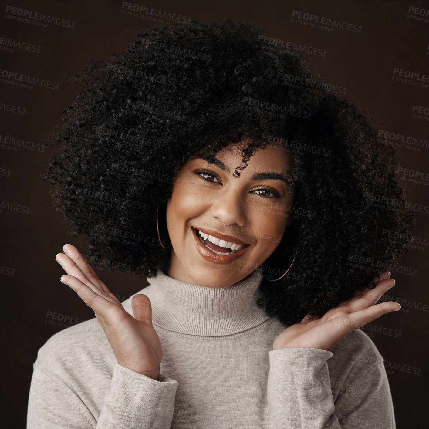 Buy stock photo Cropped portrait of an attractive young woman posing in studio against a dark background