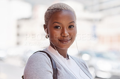 Buy stock photo Portrait, smile and black woman with earphones, city and listening to music for motivation. Face, female person and girl outdoor, headphones and streaming sounds with confidence, audio and podcast