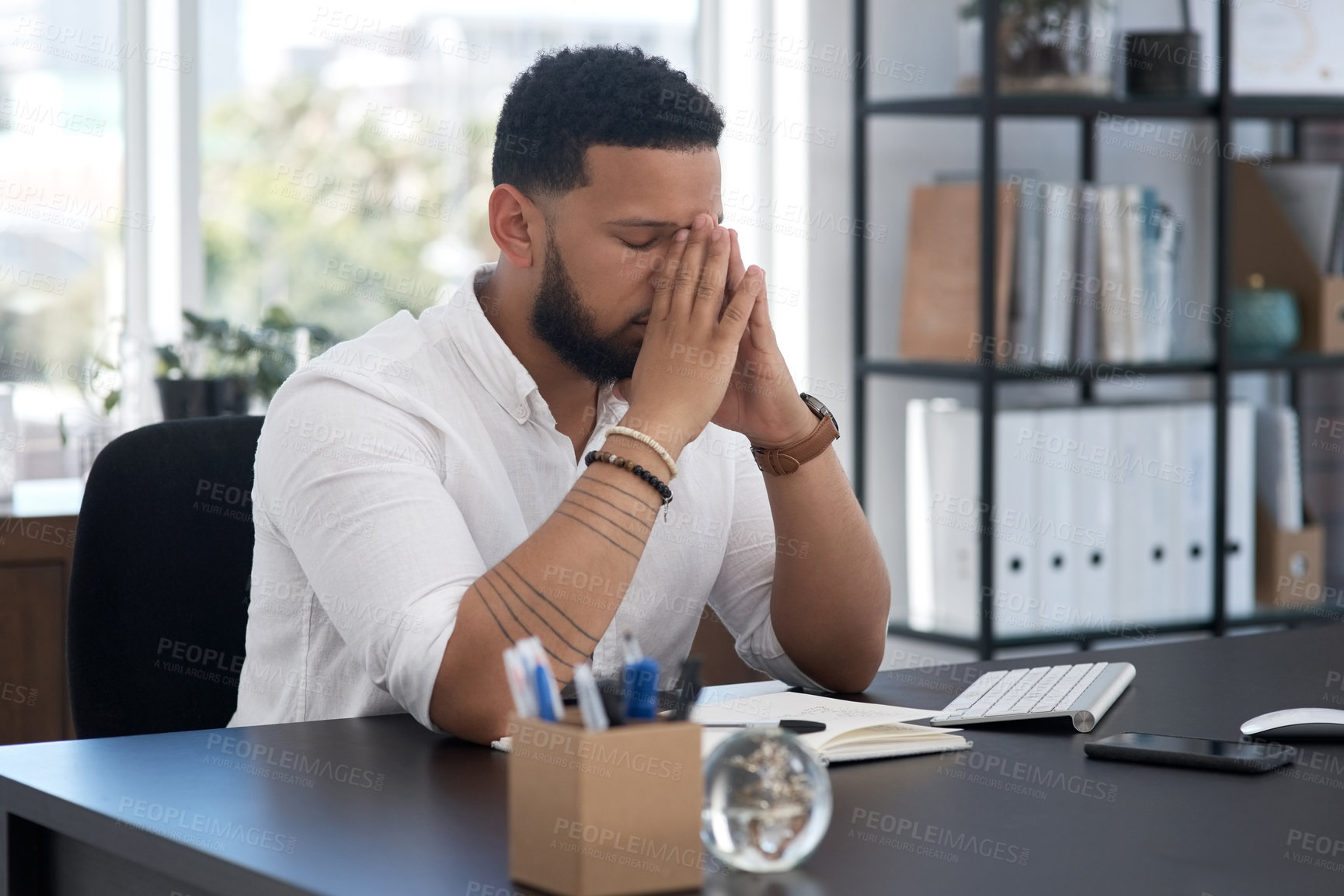 Buy stock photo Stress, burnout and tired with a business man at his desk in an office feeling the pressure of a project deadline. Headache, fatigue and frustrated with an exhausted male employee overwhelmed by work