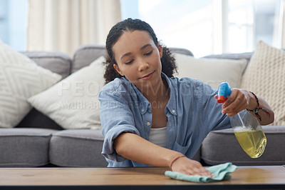 Buy stock photo Woman, cleaner and spray bottle, wipe wooden table with detergent and cloth, chemical disinfectant and housekeeping. Spring cleaning, service and female housekeeper with liquid soap and clean house