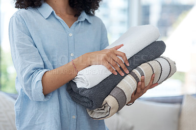 Buy stock photo Clean laundry, stack and hands with towels from the wash for the house and fresh linen. Cleaner, organize and a woman with clothes in an apartment, packing and organizing clothing for routine
