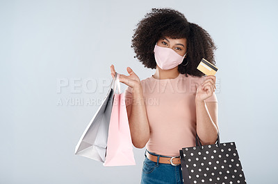 Buy stock photo Woman, face mask and shopping bags with credit card portrait for fashion, sale or discount deal. Female person or customer with a retail bag for promotion offer in studio space and white background

