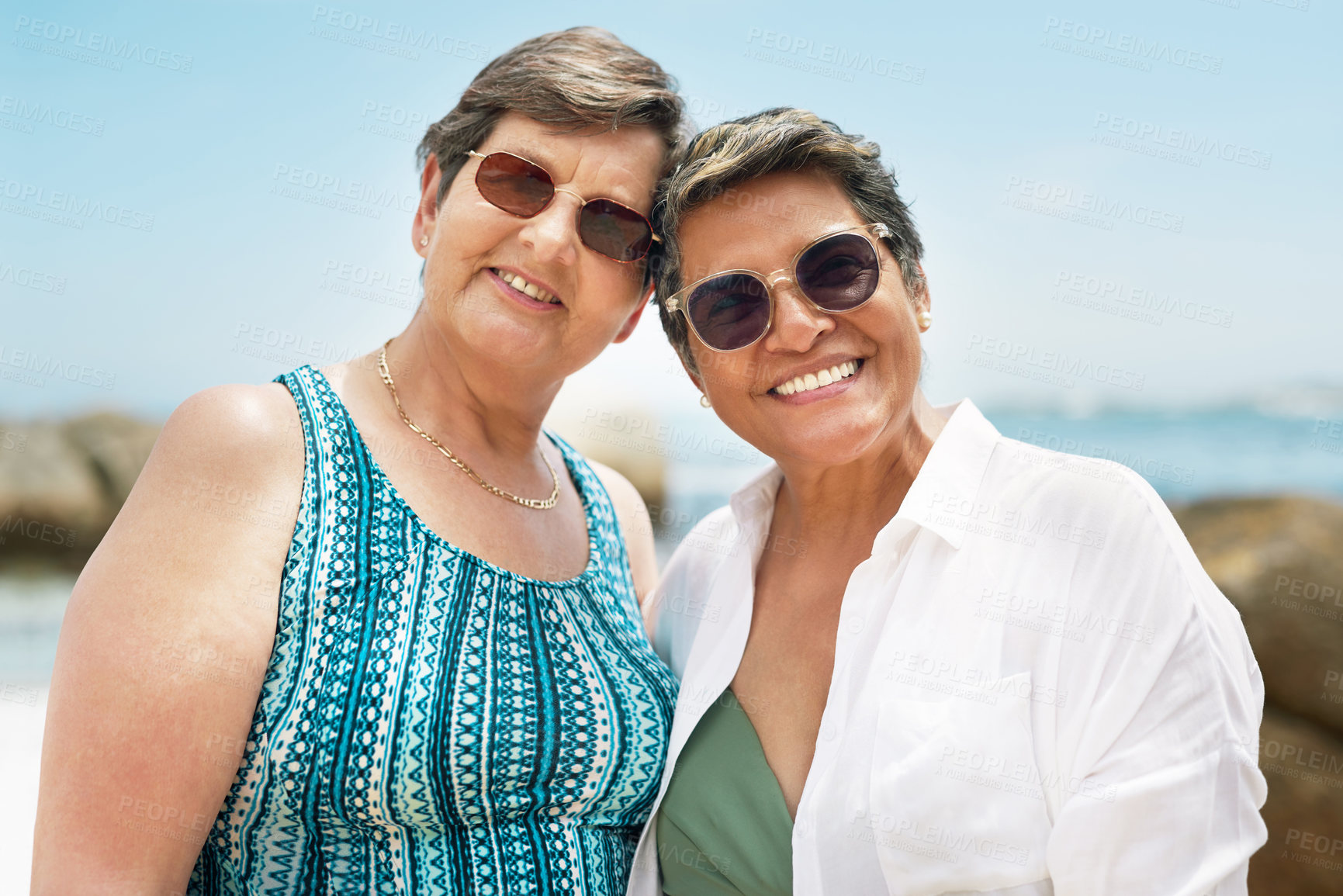 Buy stock photo Smile, portrait and sunglasses with old friends at beach for summer vacation, retirement and trip. Weekend break, tropical adventure and holiday with senior people outdoor for happy and elderly women
