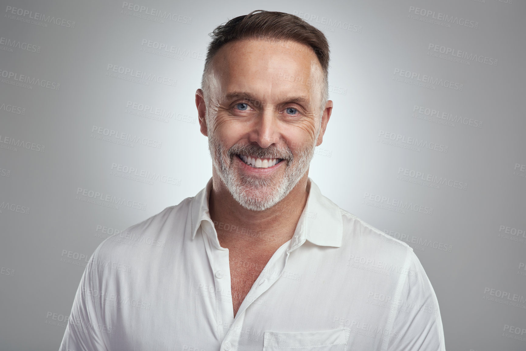 Buy stock photo Studio portrait of a mature man standing against a grey background