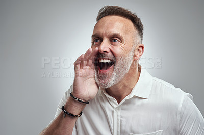 Buy stock photo Studio shot of a mature man shouting against a grey background