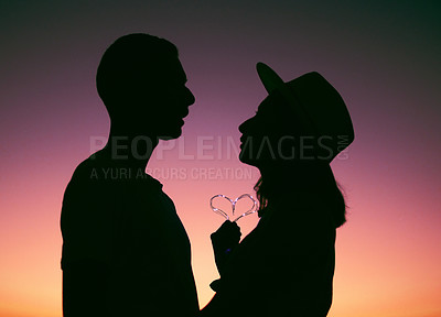 Buy stock photo Sunset, sky and silhouette of couple with heart, emoji and light on romantic outdoor date. Love, man and woman with care, affection and support for evening adventure, travel holiday and relationship.