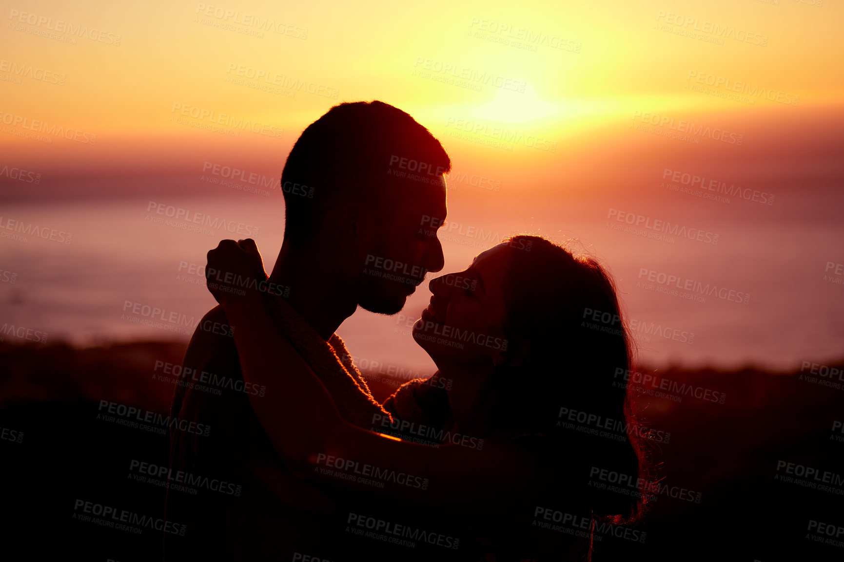 Buy stock photo Sunset, sky and silhouette of couple with hug, embrace and orange sunshine on romantic outdoor date. Love, man and woman with care, embrace and support for evening adventure, holiday and relationship