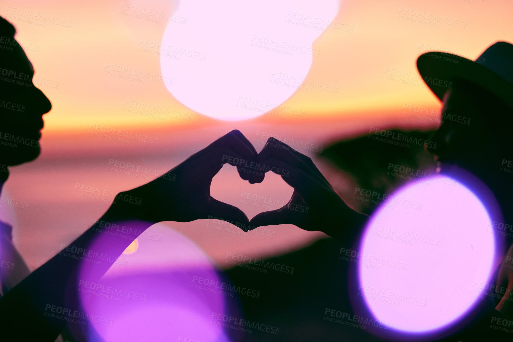 Buy stock photo Sunset sky, bokeh and silhouette of couple with heart hands, emoji and light on romantic outdoor date. Love sign, man and woman with care, affection and relationship support on evening travel holiday