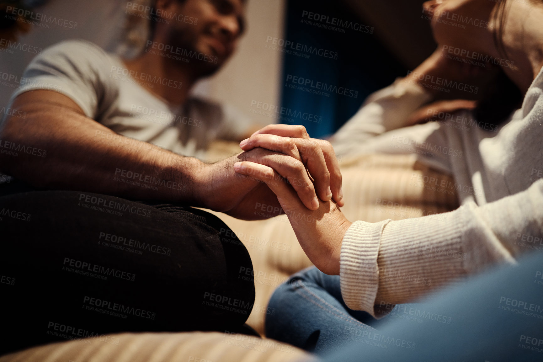 Buy stock photo Holding hands, couple and love on couch for bonding, home and support or empathy in marriage. People, trust and relax on sofa and connect on date in apartment, care and kindness in relationship