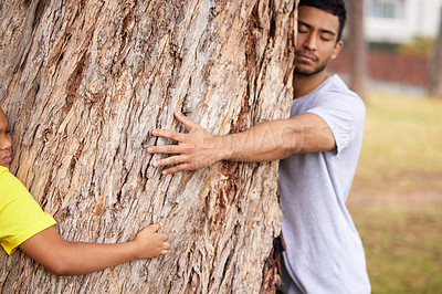 Buy stock photo Nature, environment or couple hug tree for save the planet, deforestation support or community outreach project. Earth day sustainability, eco friendly NGO charity or volunteer protect natural growth