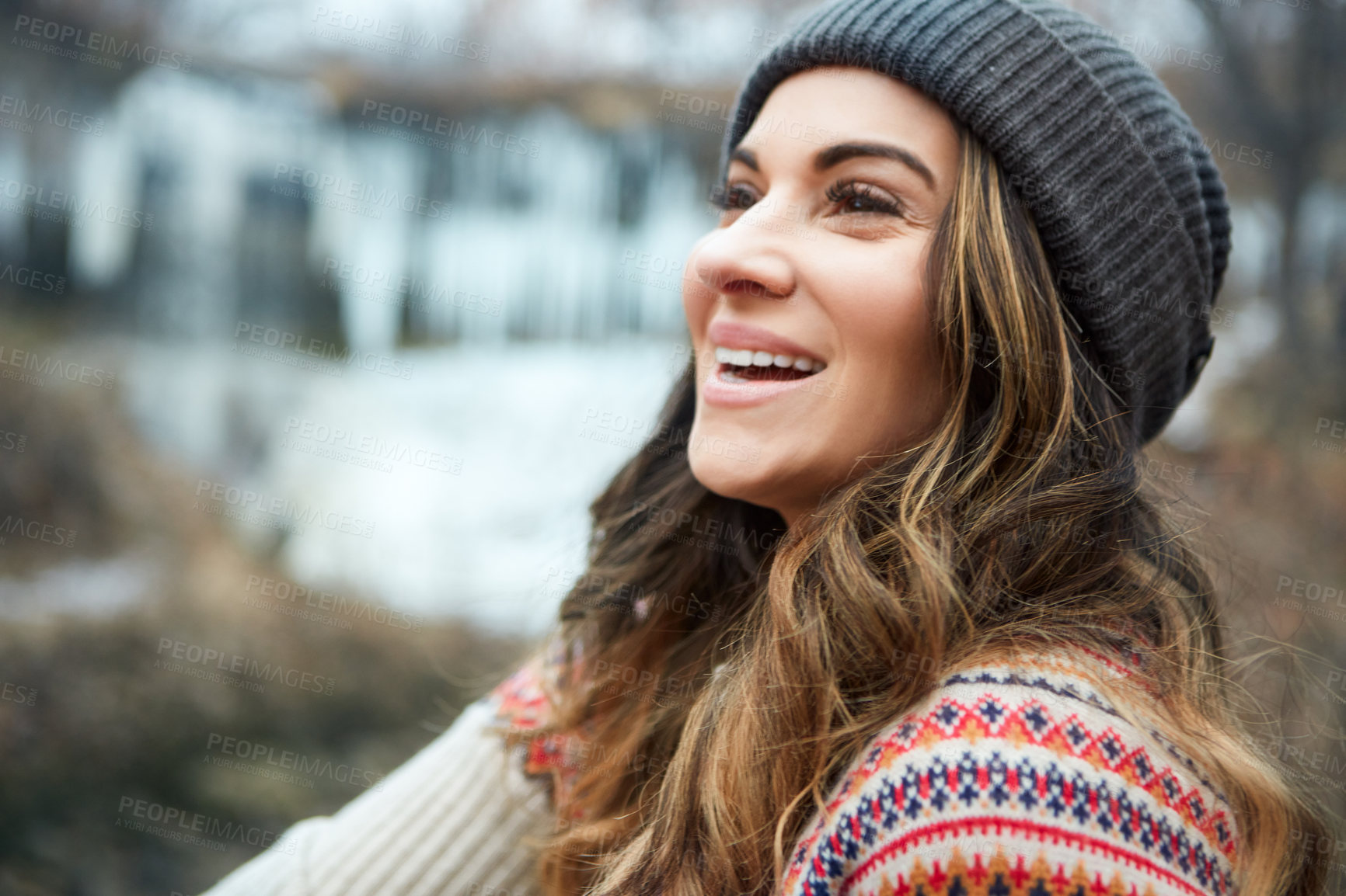 Buy stock photo Cropped shot of an attractive young woman spending the day outside during winter