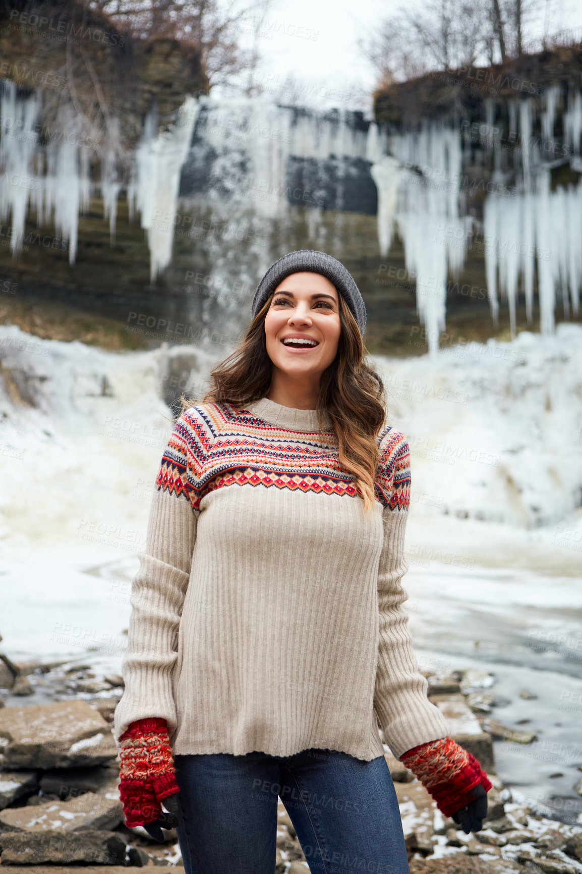 Buy stock photo Cropped shot of an attractive young woman spending the day outside during winter