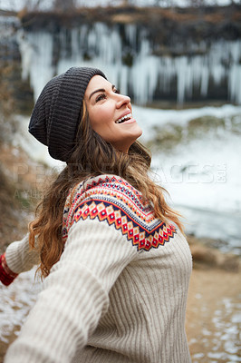 Buy stock photo Cropped shot of an attractive young woman spending the day outside during winter