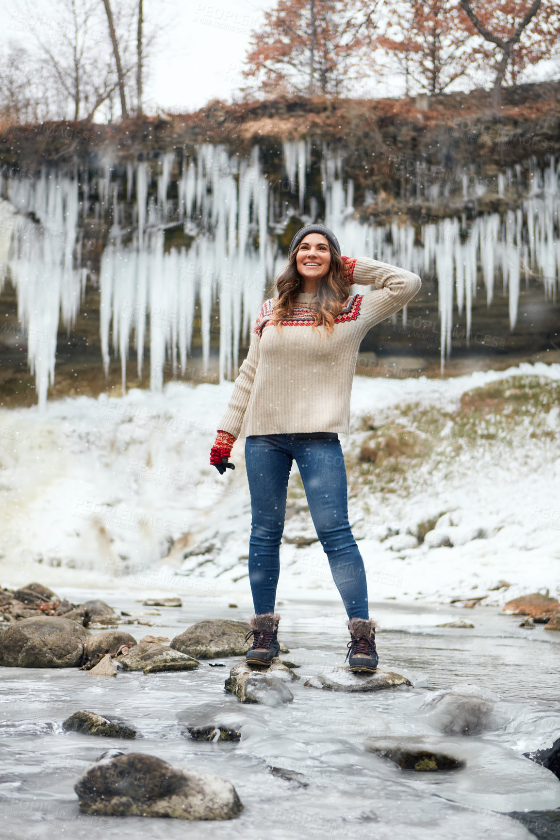 Buy stock photo Full length shot of an attractive young woman spending the day outside during winter