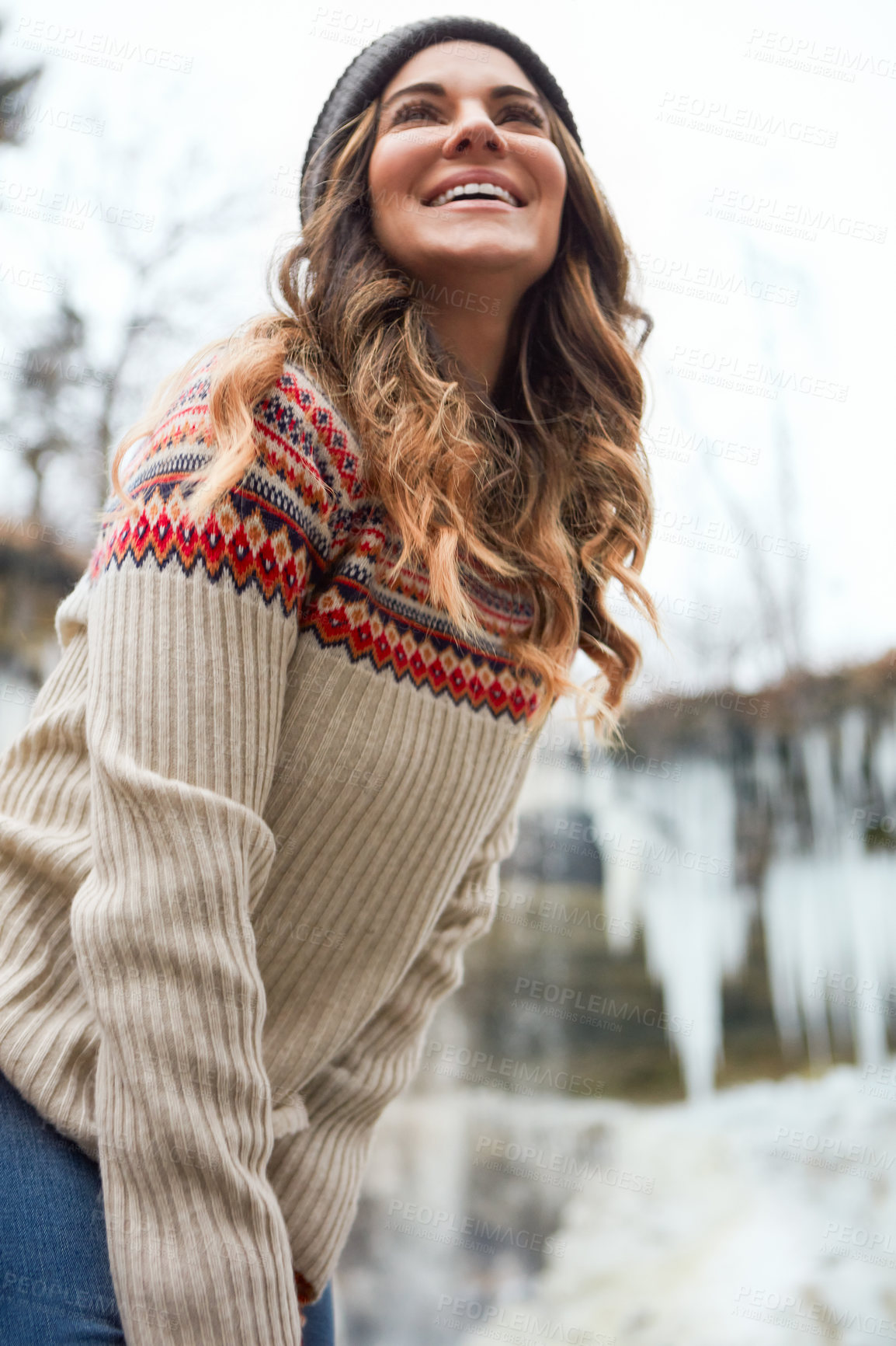 Buy stock photo Cropped shot of an attractive young woman spending the day outside during winter
