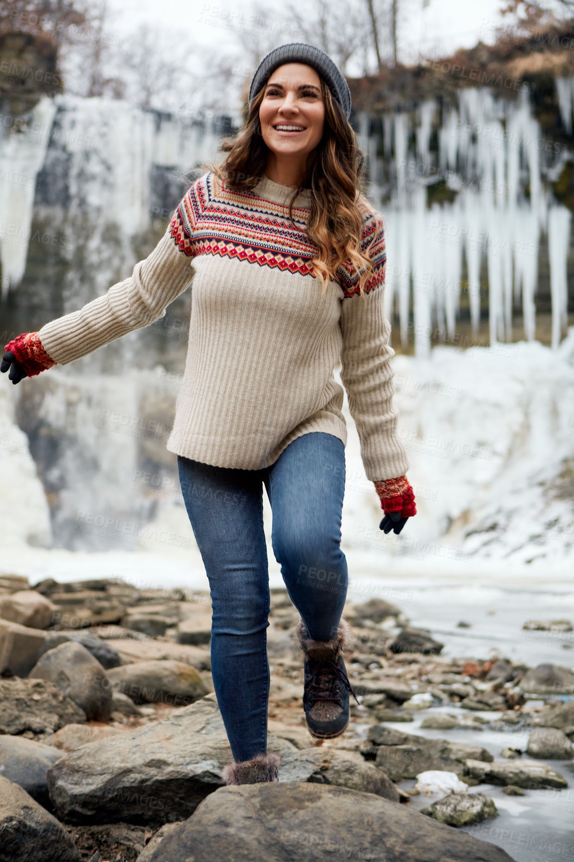 Buy stock photo Full length shot of an attractive young woman spending the day outside during winter