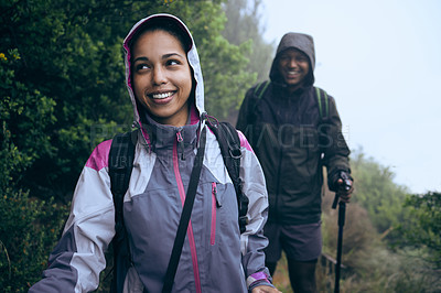 Buy stock photo Cropped shot of an affectionate young couple enjoying their early morning hike in the mountains