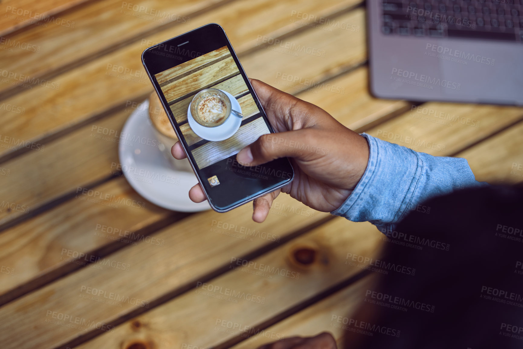 Buy stock photo Hand, person and smartphone for coffee photography in table at cafe for art, project or social media post. Influencer, gen z and screen with cup at restaurant for lunch or break with mobile app