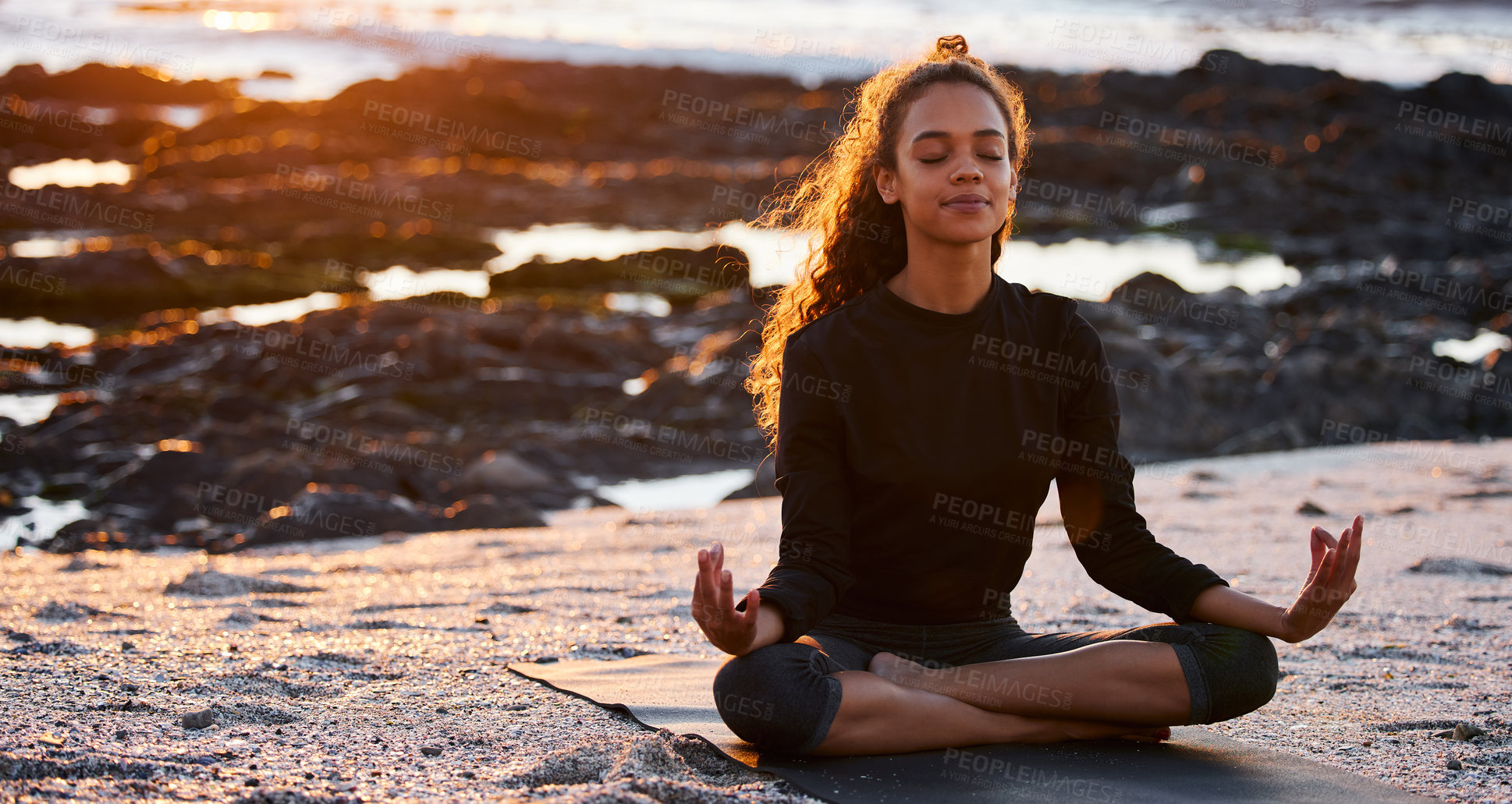 Buy stock photo Woman, beach yoga and sunset with lotus, eyes closed and peace of mind in summer sunshine. Girl, zen meditation and mindfulness for health, wellness and exercise by ocean, chakra balance and energy