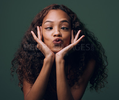 Buy stock photo Woman, silly and face with goofy expression for funny joke, humor or comedy on a dark studio background. Young female person, brunette or quirky model with crazy pout, playful mind or fun attitude