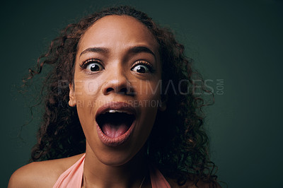 Buy stock photo Face, surprise or alarm with crazy woman, funny or comic with wide eyes on green background. Wild, quirky and playful in portrait for fun, wow with mouth open for reaction or facial expression