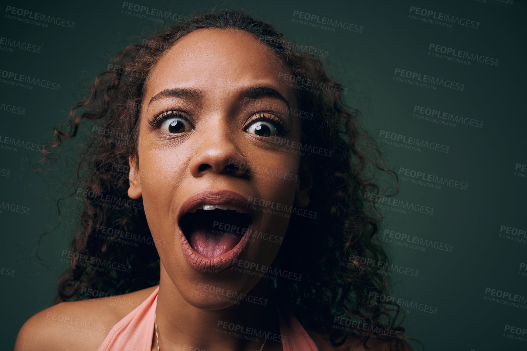 Buy stock photo Face, surprise or alarm with crazy woman, funny or comic with wide eyes on green background. Wild, quirky and playful in portrait for fun, wow with mouth open for reaction or facial expression