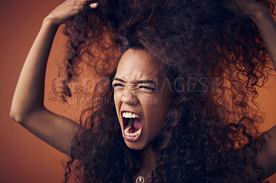 Buy stock photo Woman, curly hair and scream with anger in studio on brown background for damage, treatment and bad result. Female person, isolated and upset or disappointed at style on stress, frizz and frustrated