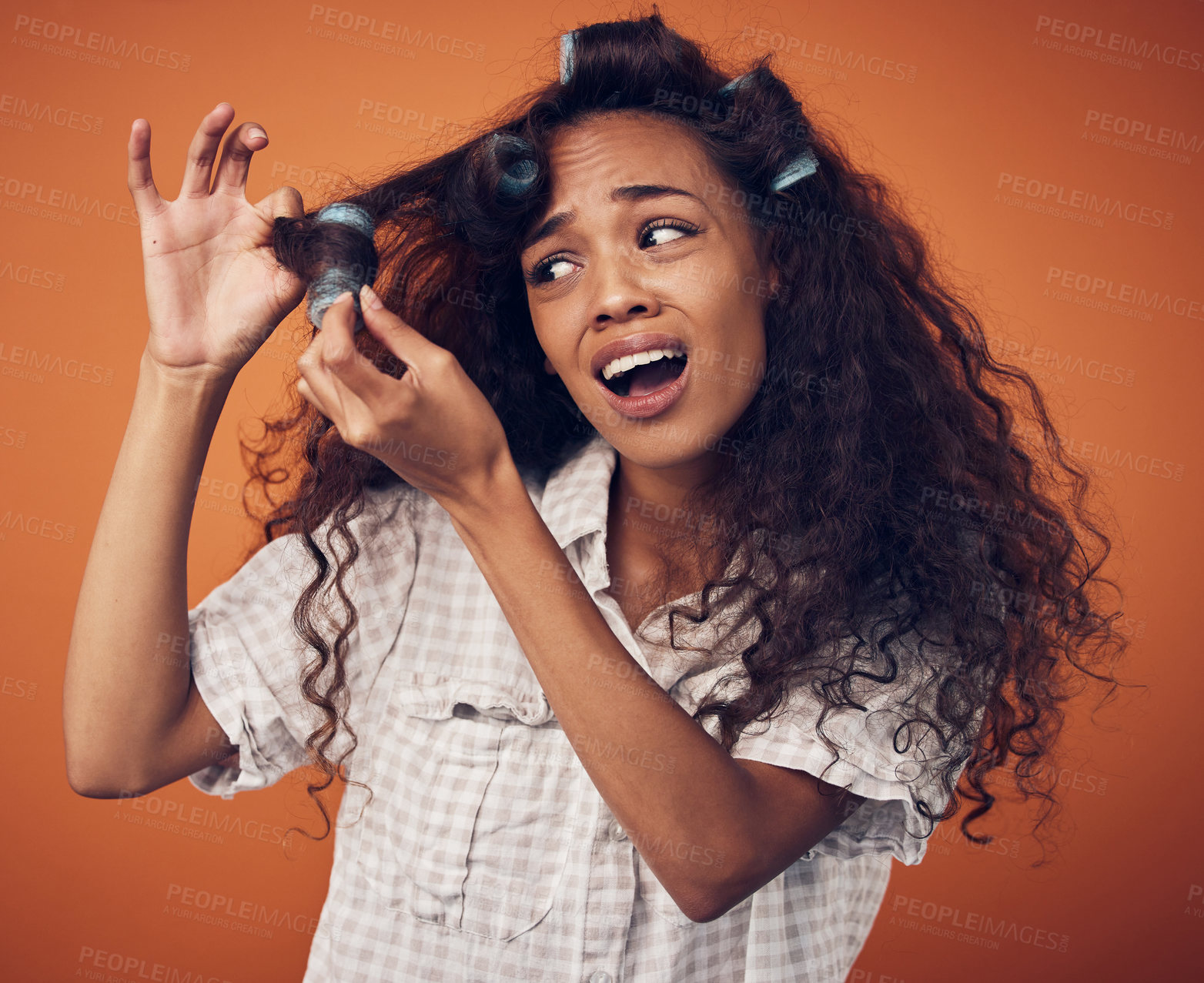 Buy stock photo Woman, hair and frustrated with roller in studio on brown background for damage, treatment and bad result. Female person, isolated and upset or disappointed at style with stress, unhappy and messy