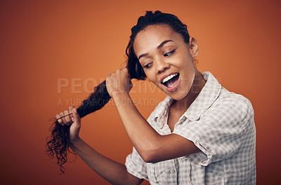 Buy stock photo Washing, beauty and woman with wet hair in studio with cosmetics, shampoo or treatment on orange background. Haircare, scalp and model with wow growth, texture or cleaning, detox and satisfaction