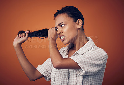 Buy stock photo Woman, hair and angry with damage in studio on brown background for routine, treatment and bad result. Female person, isolated and upset or disappointed at style with stress, unhappy and frustrated