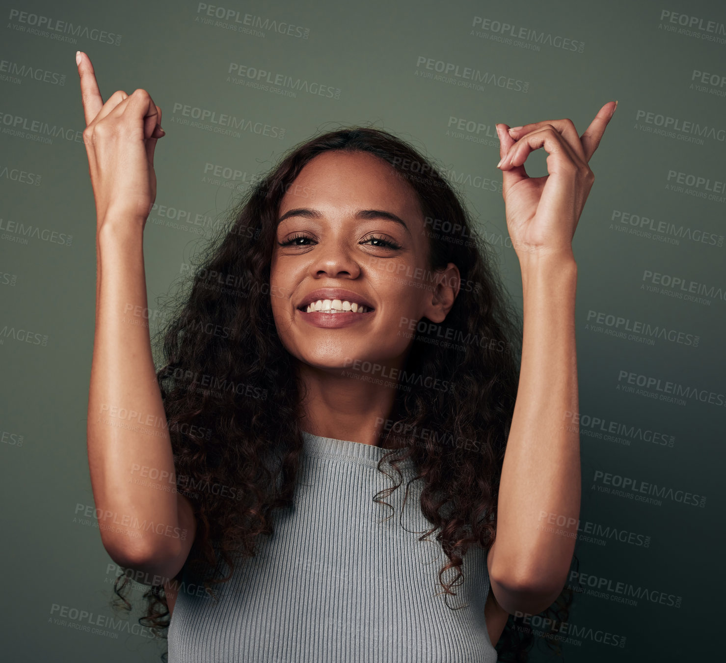 Buy stock photo Pointing up, happy and portrait of woman on green background for news, announcement and deal. Showing, smile and isolated person with hand gesture for choice, promotion and advertising in studio