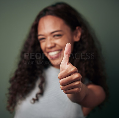 Buy stock photo Woman, thumbs up and hand gesture with emoji and agreement, approval and feedback isolated on green background. Yes, like and thank you with happy female person, OK sign and support closeup in studio
