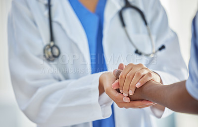 Buy stock photo Doctor, holding hands and patient with support, help and grief consulting after cancer news. Hospital, healthcare and clinic worker with person supporting with guidance and advice from health results