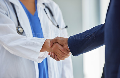 Buy stock photo Business handshake and doctor partnership in a hospital with thank you and greeting gesture. Clinic, healthcare and professional deal shaking hands with agreement and contract success for b2b